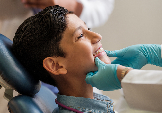 child's teeth being examined