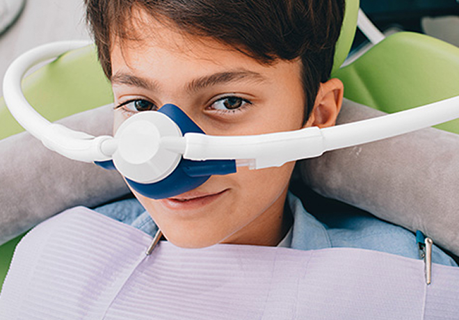 boy wearing nitrous oxide mask
